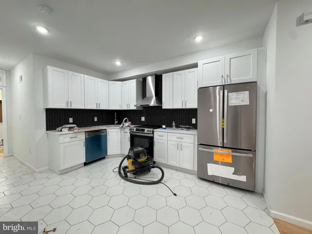 a kitchen with a sink a stove and refrigerator