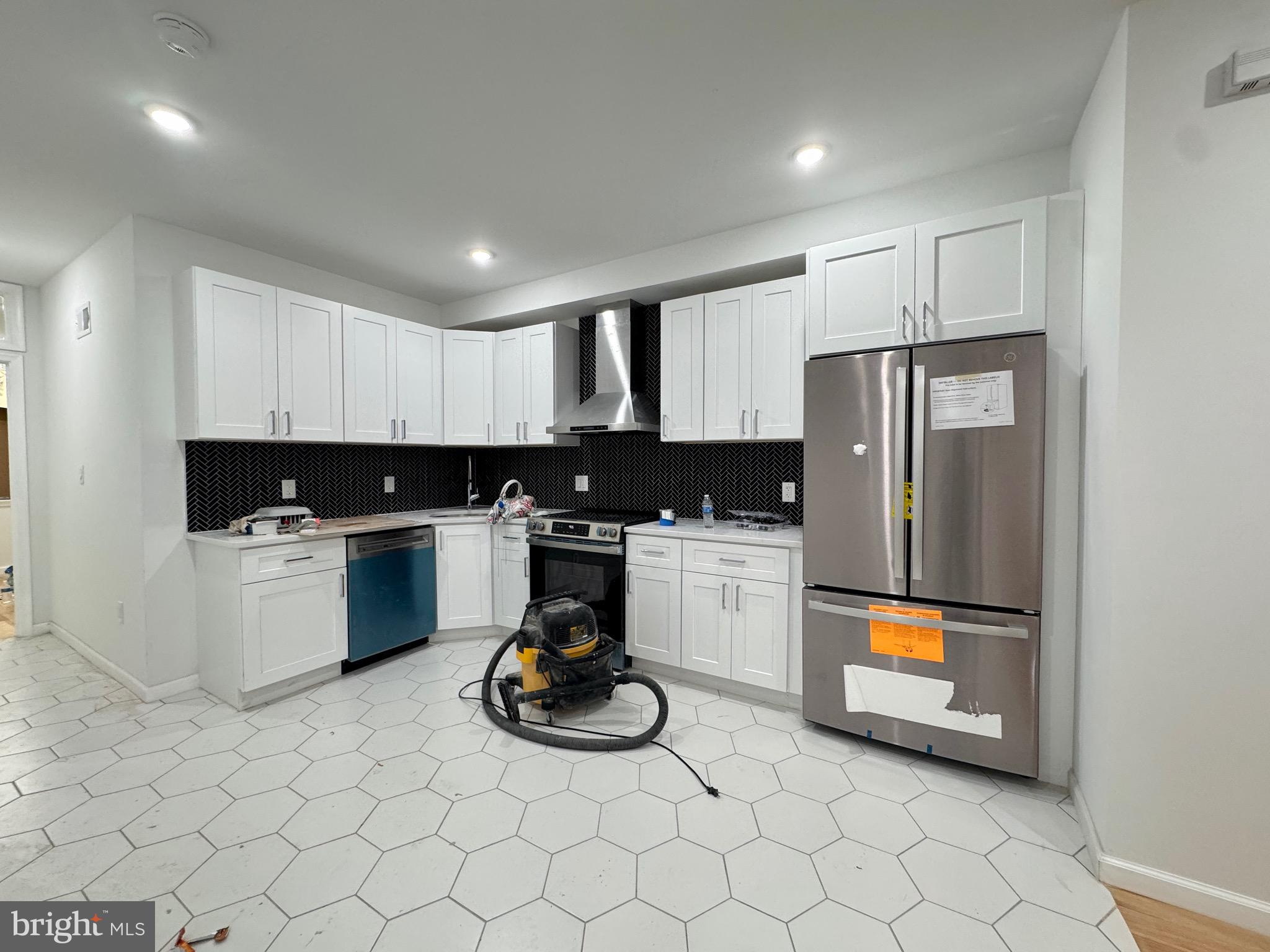781 South 3rd Street, Unit 1 Philadelphia, PA 19147 - Photo 4 of 18 a kitchen with a sink a stove and refrigerator