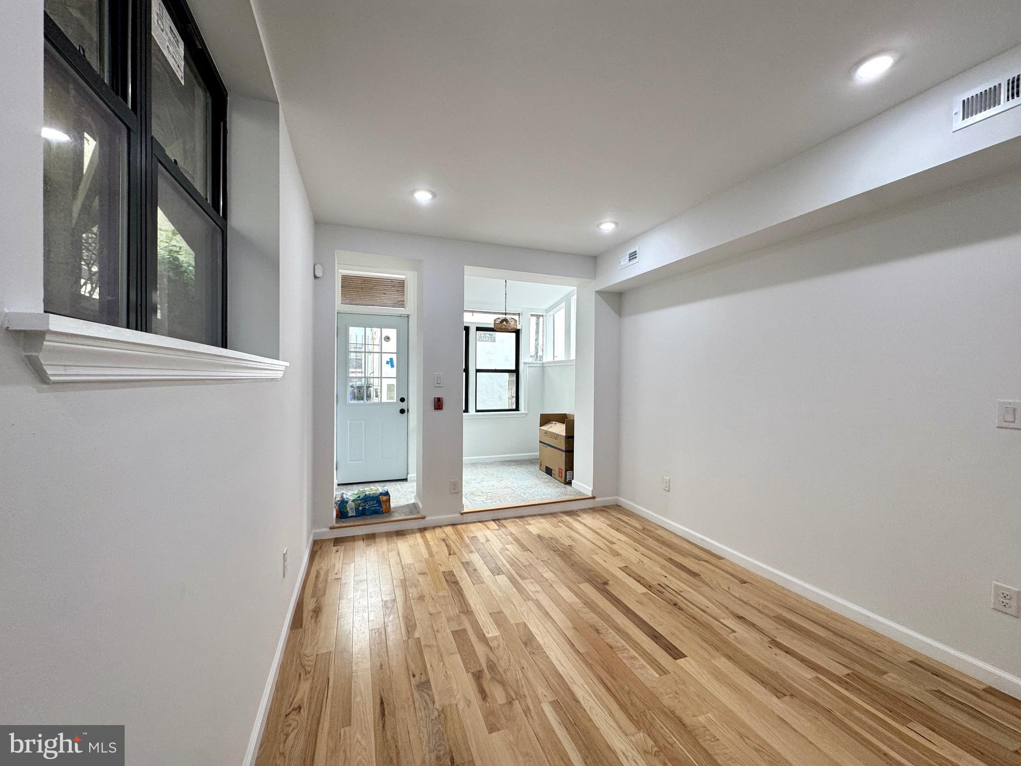 781 South 3rd Street, Unit 1 Philadelphia, PA 19147 - Photo 5 of 18 a view of a big room with wooden floor and windows