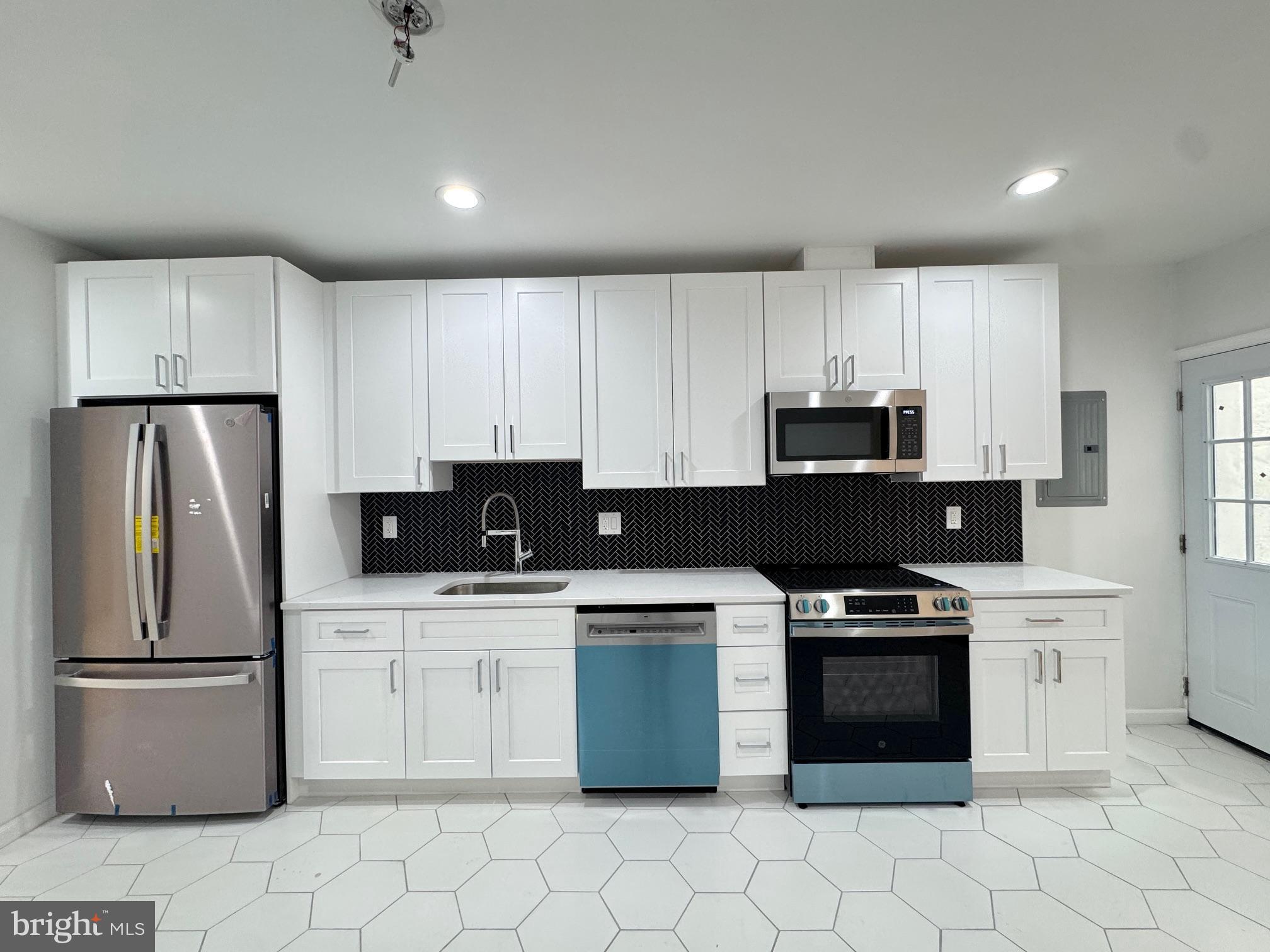 781 South 3rd Street, Unit 3 Philadelphia, PA 19147 - Photo 7 of 17 a kitchen with a stove sink and refrigerator