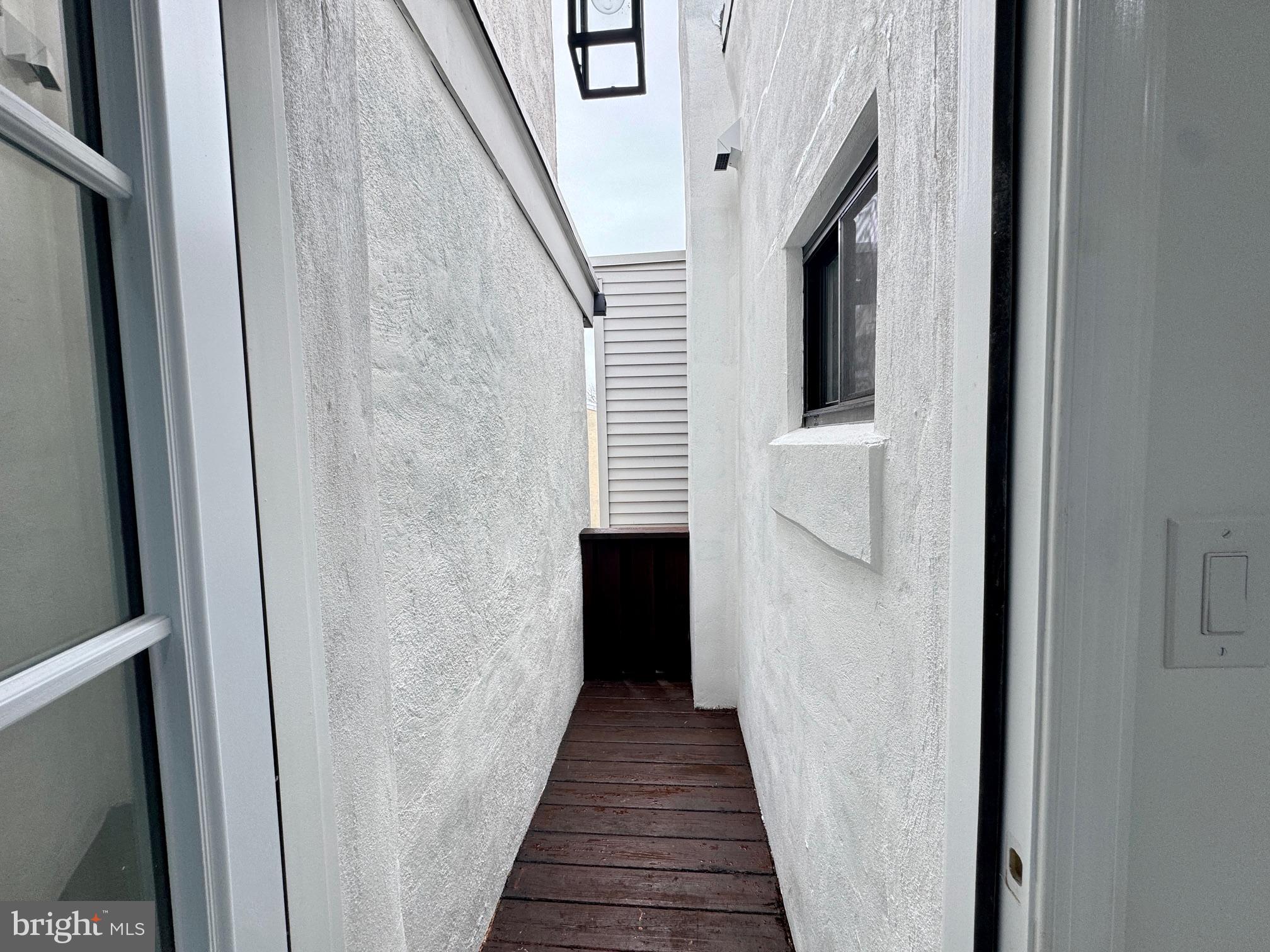 781 South 3rd Street, Unit 3 Philadelphia, PA 19147 - Photo 9 of 17 a view of a hallway with wooden floor and staircase