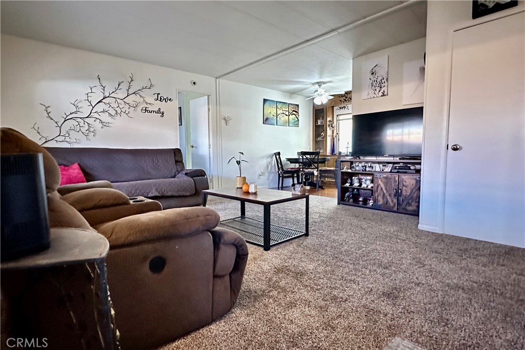 3745 Valley Boulevard, Unit 12 Walnut, CA 91789 - Photo 11 of 43 a living room with furniture and a flat screen tv