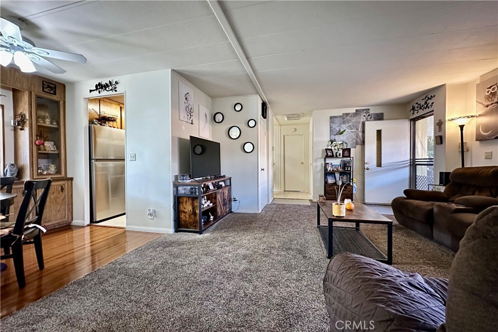 3745 Valley Boulevard, Unit 12 Walnut, CA 91789 - Photo 12 of 43 a living room with furniture and a flat screen tv