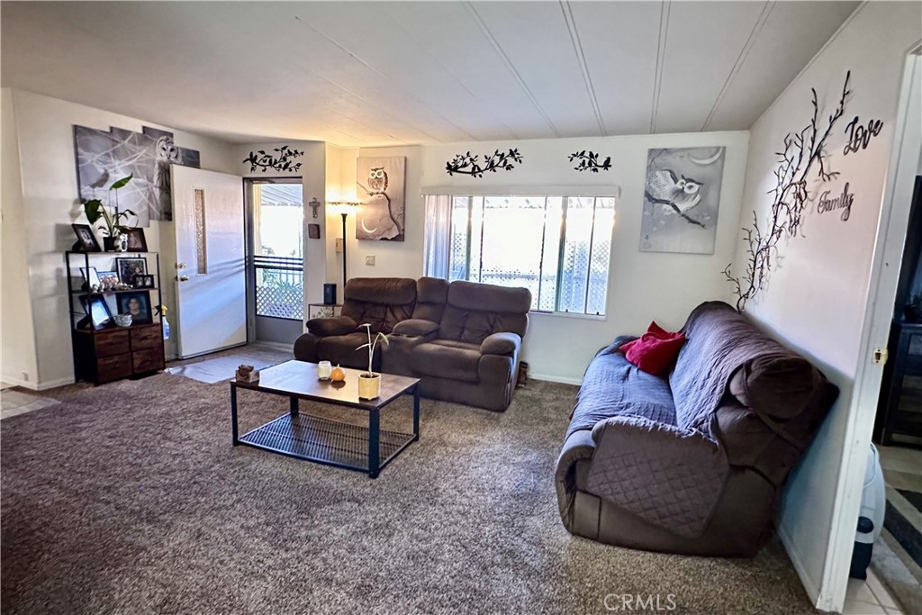 3745 Valley Boulevard, Unit 12 Walnut, CA 91789 - Photo 13 of 43 a living room with furniture and a window