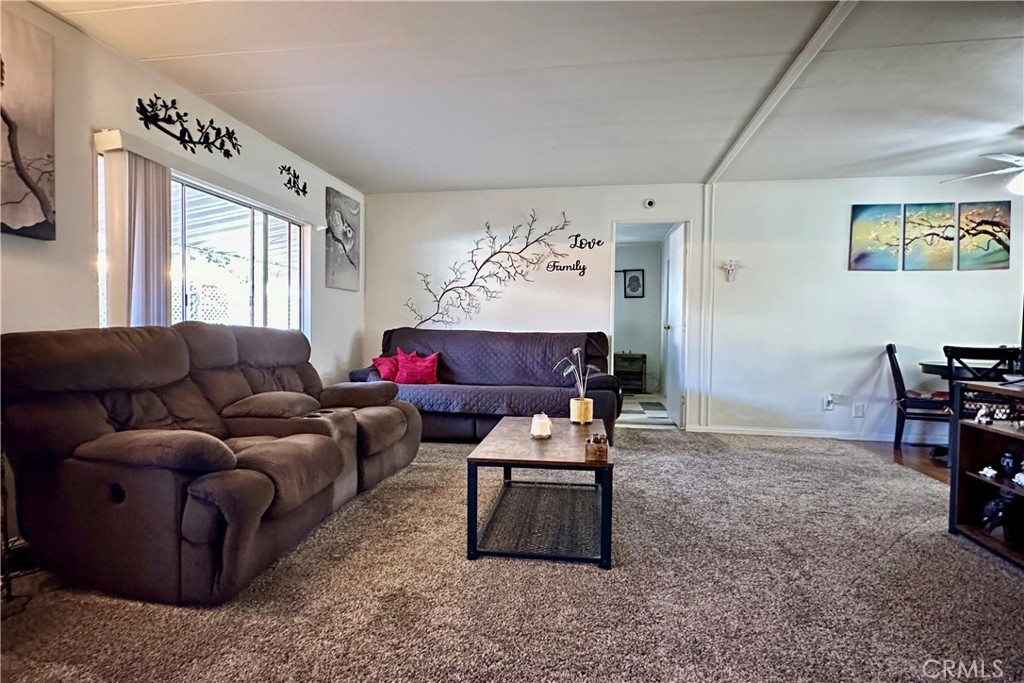 3745 Valley Boulevard, Unit 12 Walnut, CA 91789 - Photo 14 of 43 a living room with furniture a bed and a window