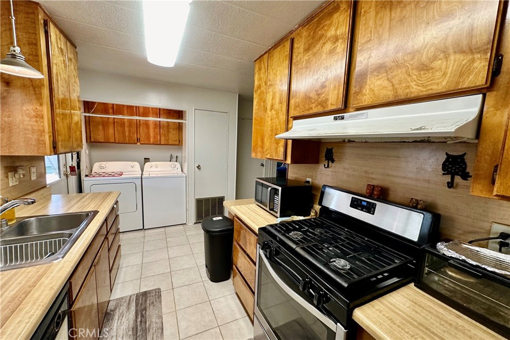 3745 Valley Boulevard, Unit 12 Walnut, CA 91789 - Photo 16 of 43 a kitchen with a stove and a sink