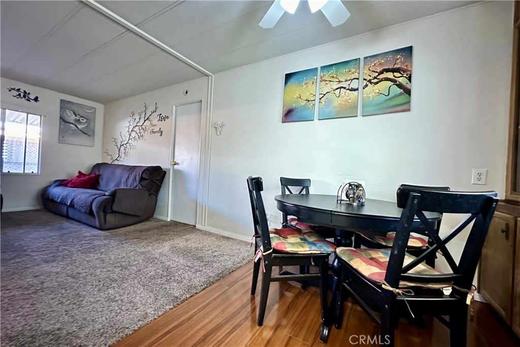 3745 Valley Boulevard, Unit 12 Walnut, CA 91789 - Photo 19 of 43 a living room with furniture and a wooden floor