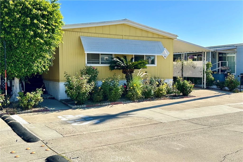3745 Valley Boulevard, Unit 12 Walnut, CA 91789 - Photo 2 of 43 front view of house with potted plants