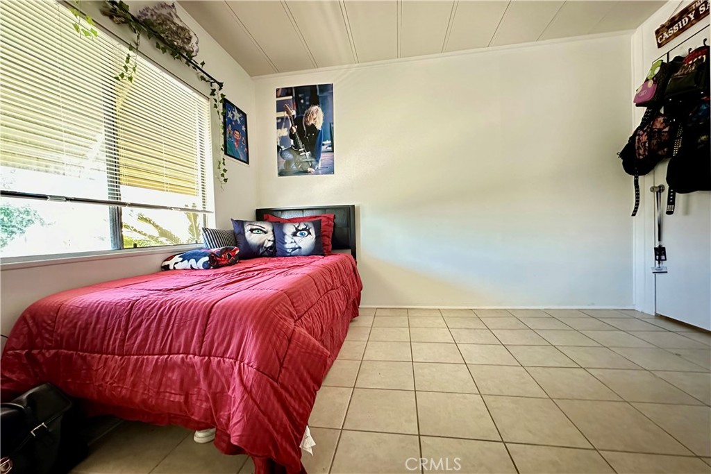 3745 Valley Boulevard, Unit 12 Walnut, CA 91789 - Photo 31 of 43 a bedroom with a bed and a window