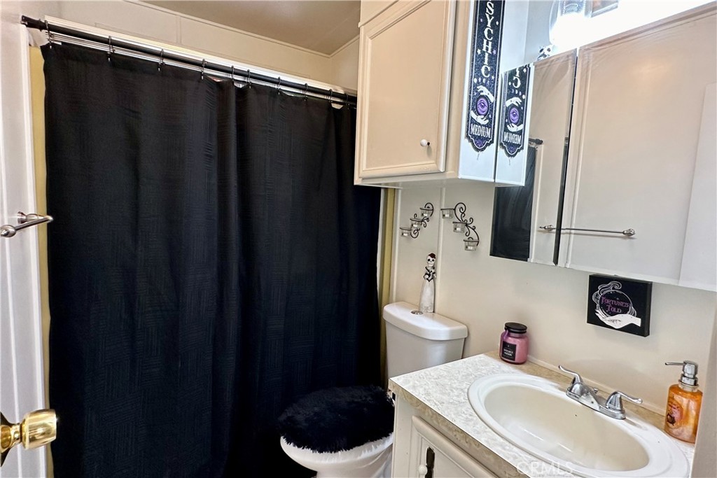 3745 Valley Boulevard, Unit 12 Walnut, CA 91789 - Photo 35 of 43 a bathroom with a sink toilet and shower