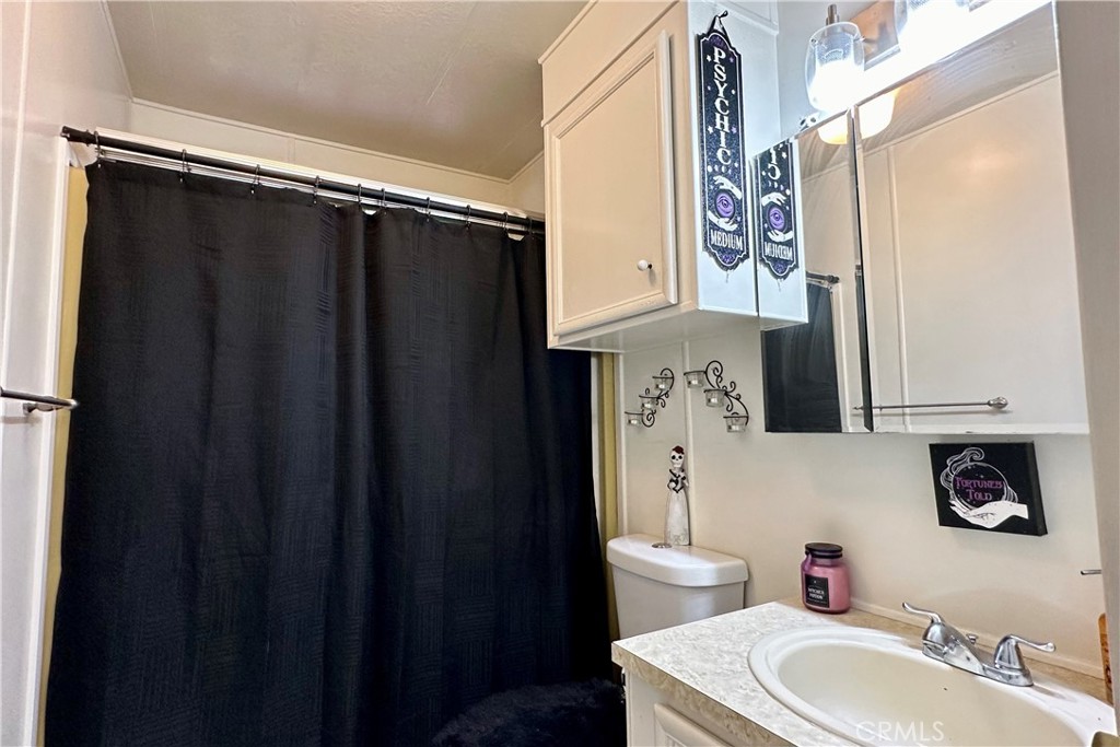 3745 Valley Boulevard, Unit 12 Walnut, CA 91789 - Photo 36 of 43 a bathroom with a sink toilet and shower