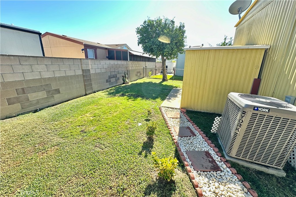 3745 Valley Boulevard, Unit 12 Walnut, CA 91789 - Photo 38 of 43 a view of a backyard with wooden fence