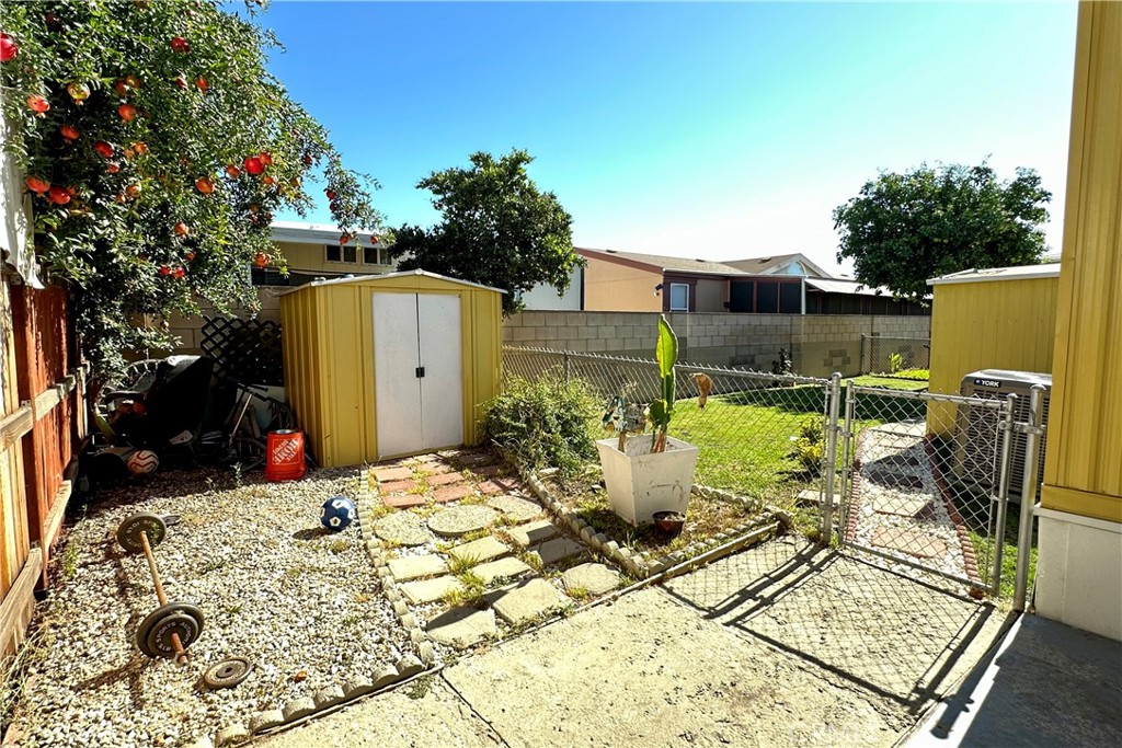 3745 Valley Boulevard, Unit 12 Walnut, CA 91789 - Photo 40 of 43 a view of a patio with table and chairs potted plants with wooden floor