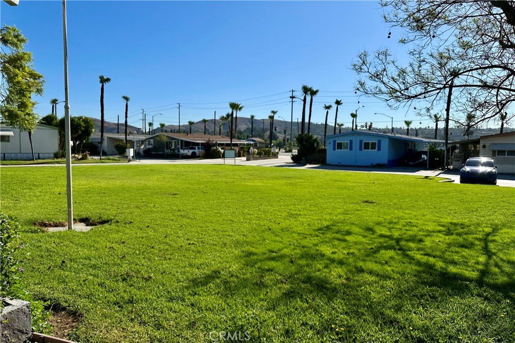3745 Valley Boulevard, Unit 12 Walnut, CA 91789 - Photo 7 of 43 a view of a garden with a house