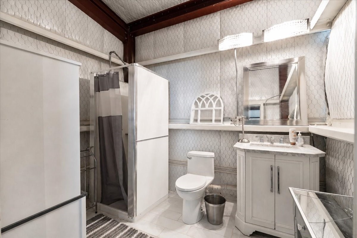 16375 Grand Flower Road Plantersville, TX 77363 - Photo 8 of 50 a bathroom with a toilet sink shower and mirror