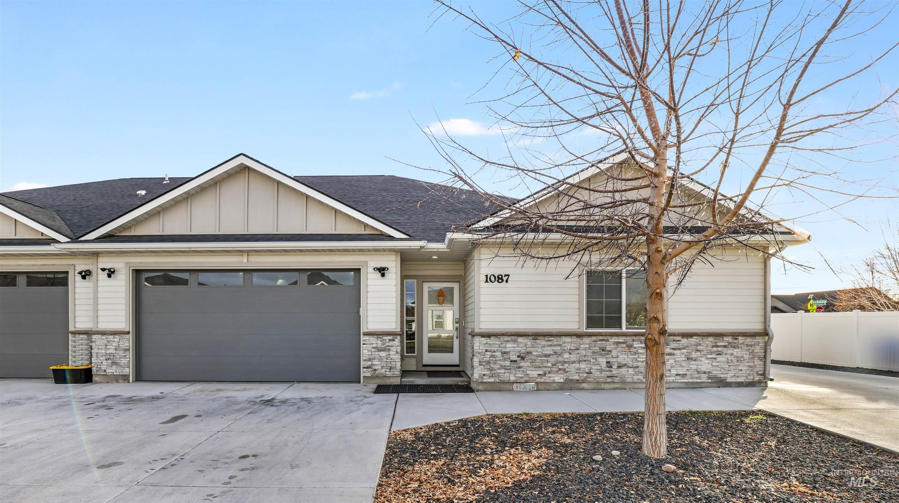 1087 Easy Avenue Twin Falls, ID 83301 - Photo 1 of 25 Contemporary single-story residence featuring light-toned siding and stone veneer accents