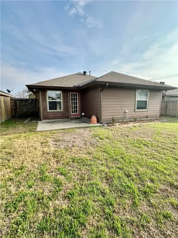 a house with yard in front of it
