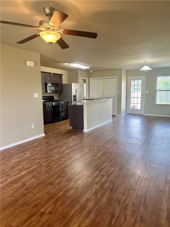 1134 Cottage Grove Circle Bryan, TX 77801 - Photo 8 of 22 a view of a kitchen with a sink and a microwave
