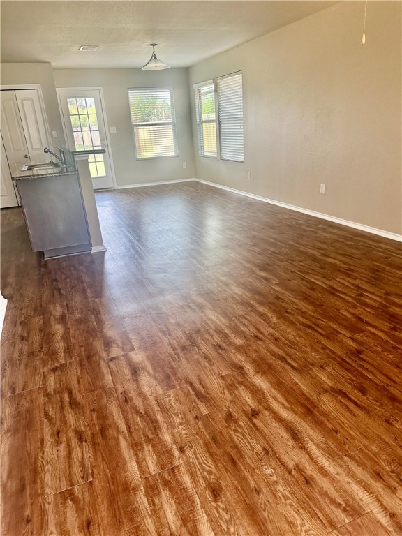 1134 Cottage Grove Circle Bryan, TX 77801 - Photo 9 of 22 an empty room with wooden floor and windows