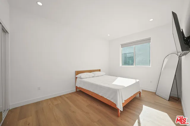 a room with a bed and a window