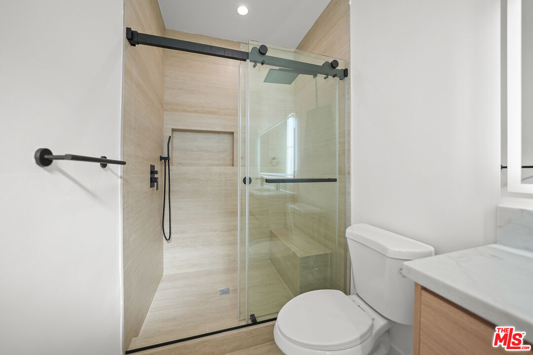 13692 Erwin Street, Unit A Van Nuys, CA 91401 - Photo 30 of 47 a bathroom with a shower and a toilet