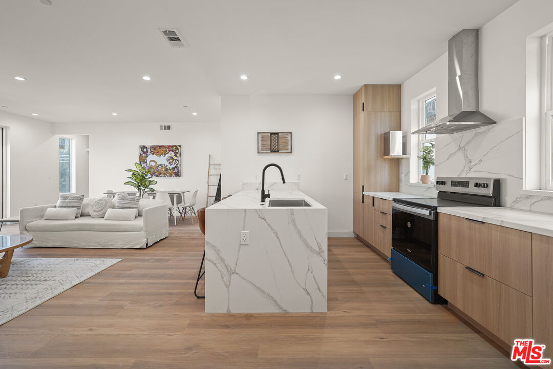 13692 Erwin Street, Unit A Van Nuys, CA 91401 - Photo 8 of 47 a living room with furniture and kitchen