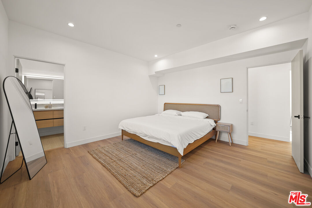 13692 Erwin Street, Unit A Van Nuys, CA 91401 - Photo 10 of 47 a bedroom with a bed and a chair