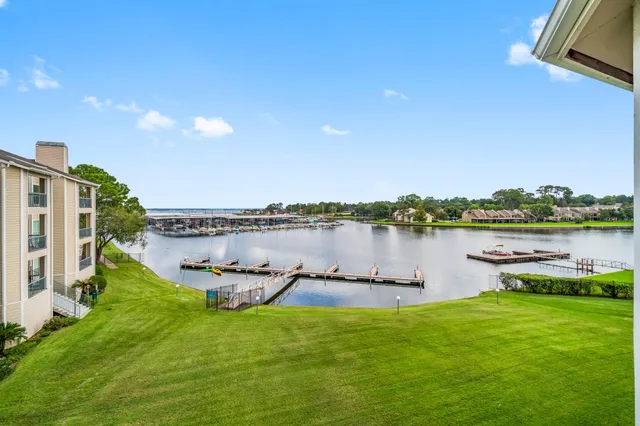 a view of a lake with houses in the back
