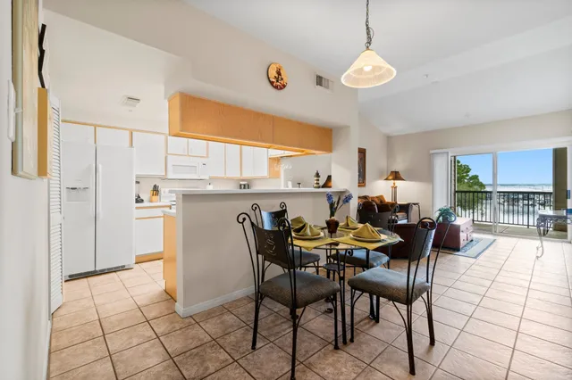 a view of a dining room with furniture and window