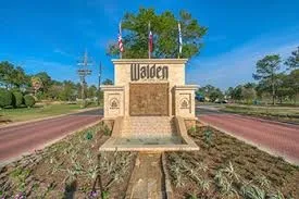 a sign board with parking space