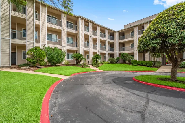 a view of a swimming pool with a yard