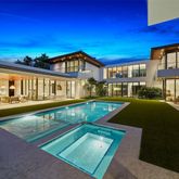 a view of an swimming pool with an outdoor seating