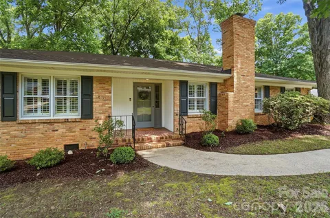 front view of a house with potted plants