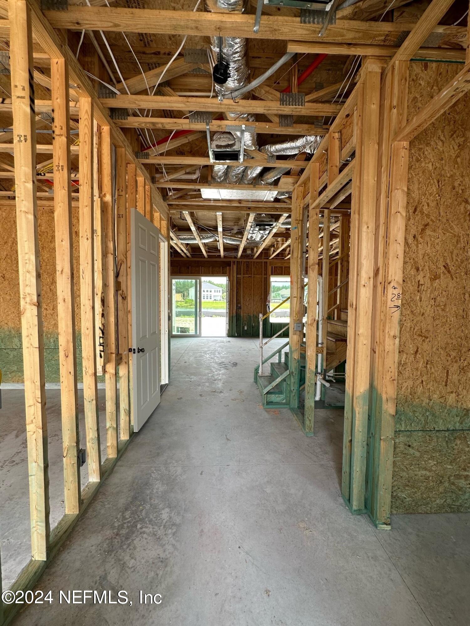 156 Iris Crk Drive St. Augustine, FL 32092 - Photo 8 of 33 a view of a room with wooden walls