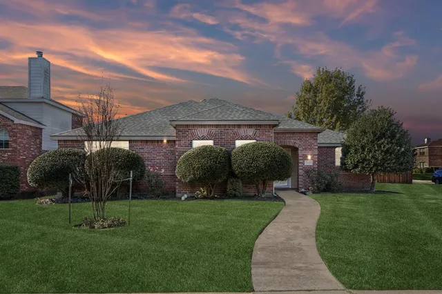 front view of a house with a yard