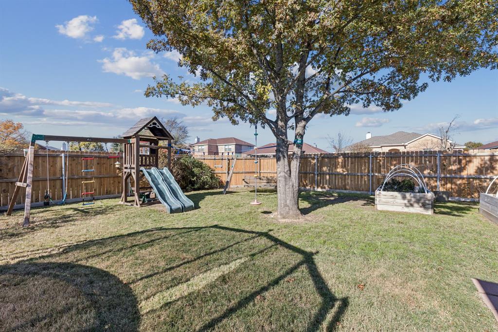 1421 Heather Ridge Drive Lancaster, TX 75146 - Photo 19 of 22 a view of a house with backyard porch and sitting area