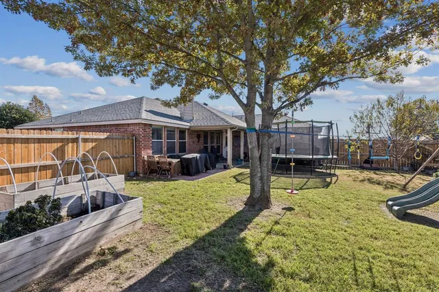 a view of a house with swimming pool and sitting area