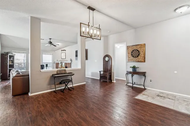 a view of a livingroom with furniture and a workspace