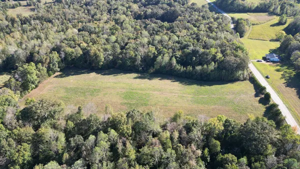 a aerial view of a house with a yard
