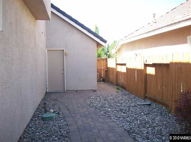9668 Rolling Rock Way Reno, NV 89521 - Photo 8 of 9 a view of a backyard with pathway