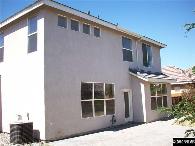 9668 Rolling Rock Way Reno, NV 89521 - Photo 9 of 9 a front view of a house with large windows