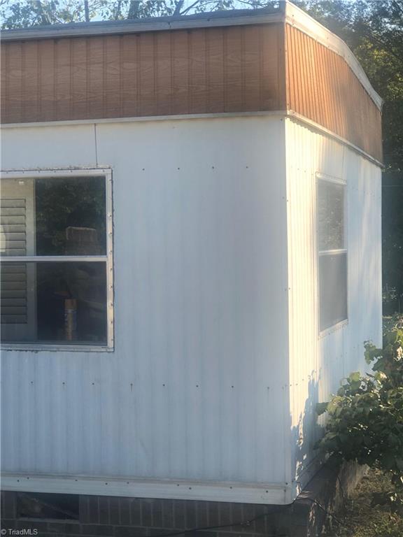 4044 Sawmill Road Winston-Salem, NC 27107 - Photo 3 of 4 Closeup from southwest side. trailer stands on .57 acres.