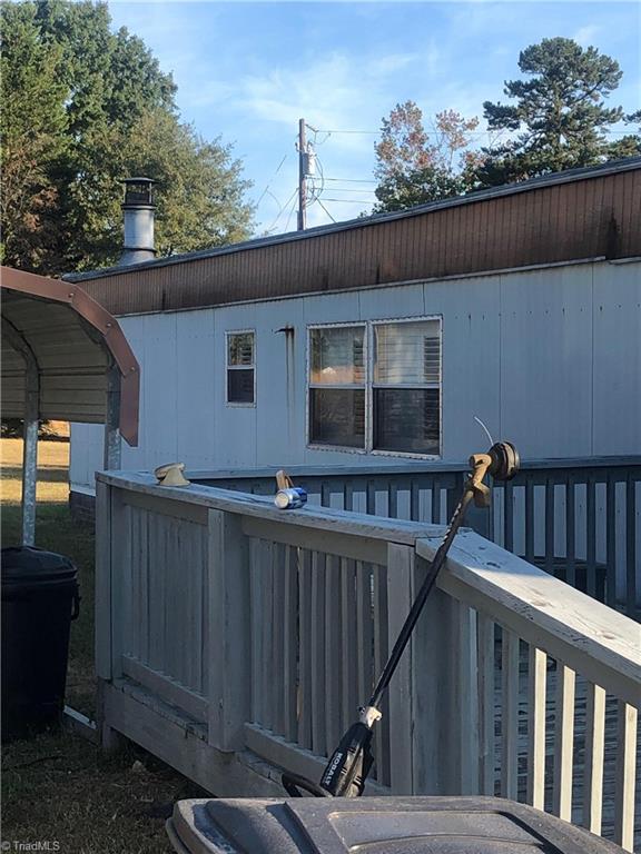 4044 Sawmill Road Winston-Salem, NC 27107 - Photo 4 of 4 Trailer has handicapped-accessible ramp which is conveniently positioned beside carport and attached to the rear to preserve front aesthetic.