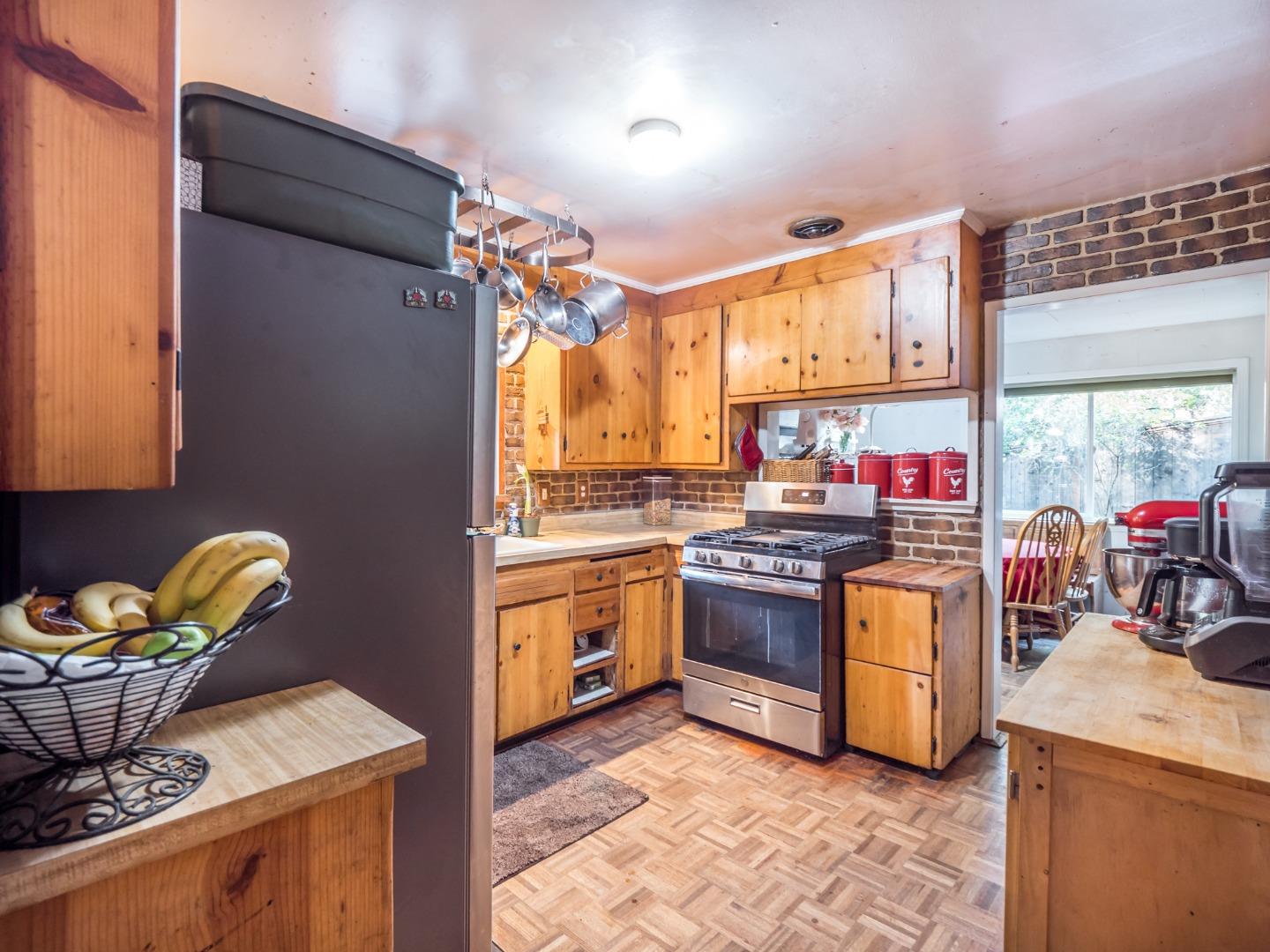 10970 Riverside Road Brookdale, CA 95005 - Photo 15 of 27 a kitchen with stainless steel appliances granite countertop a stove a sink and a refrigerator