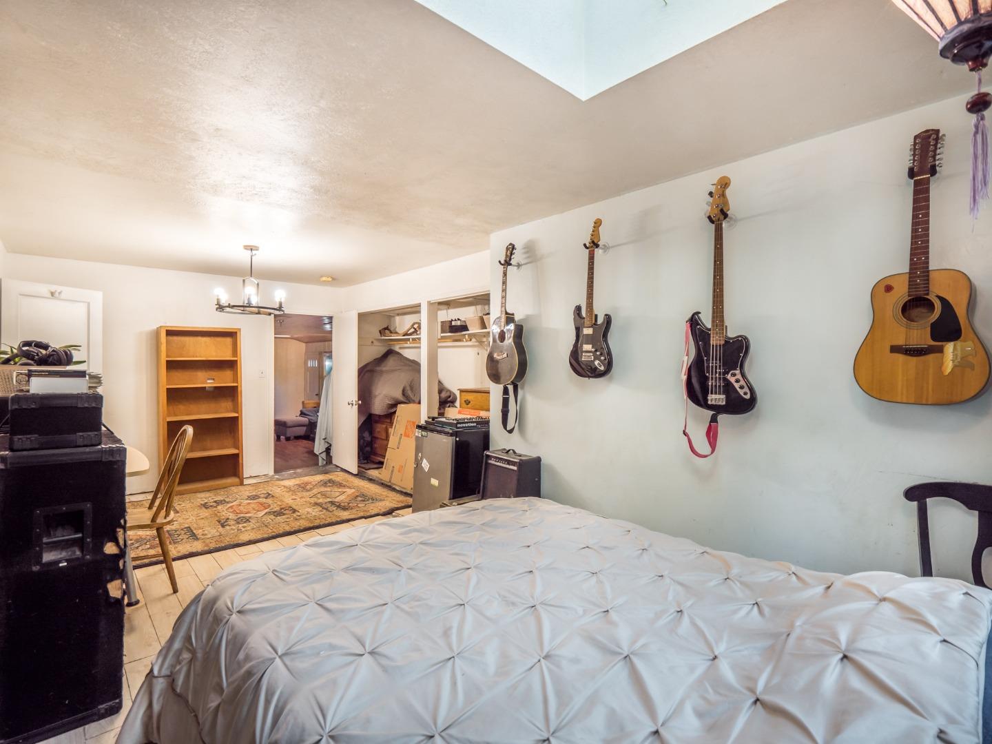 10970 Riverside Road Brookdale, CA 95005 - Photo 24 of 27 a bedroom with a bed and dresser