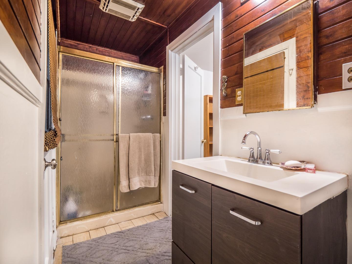 10970 Riverside Road Brookdale, CA 95005 - Photo 26 of 27 a bathroom with a sink and a mirror