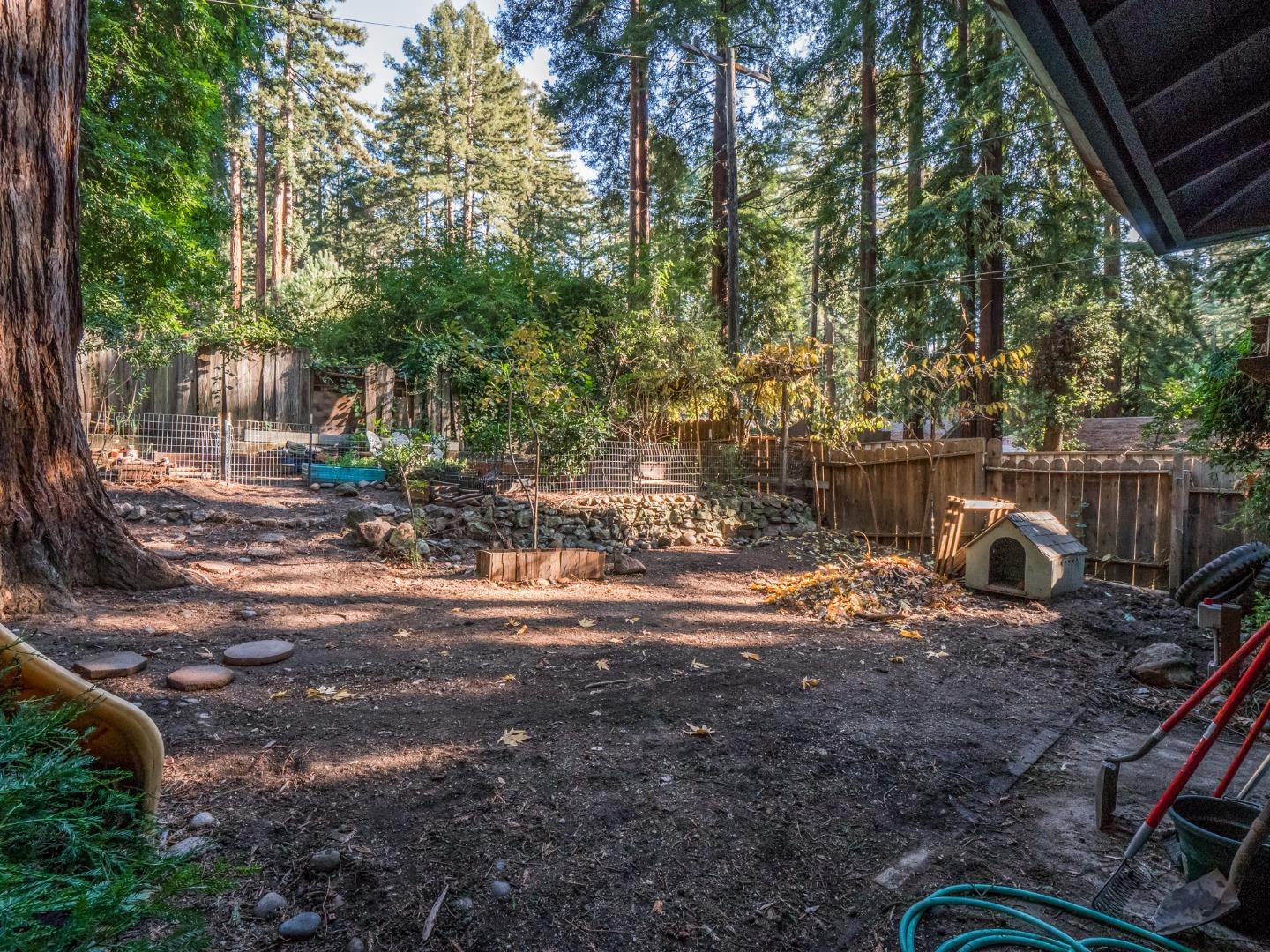 10970 Riverside Road Brookdale, CA 95005 - Photo 10 of 27 a view of a yard with plants and trees