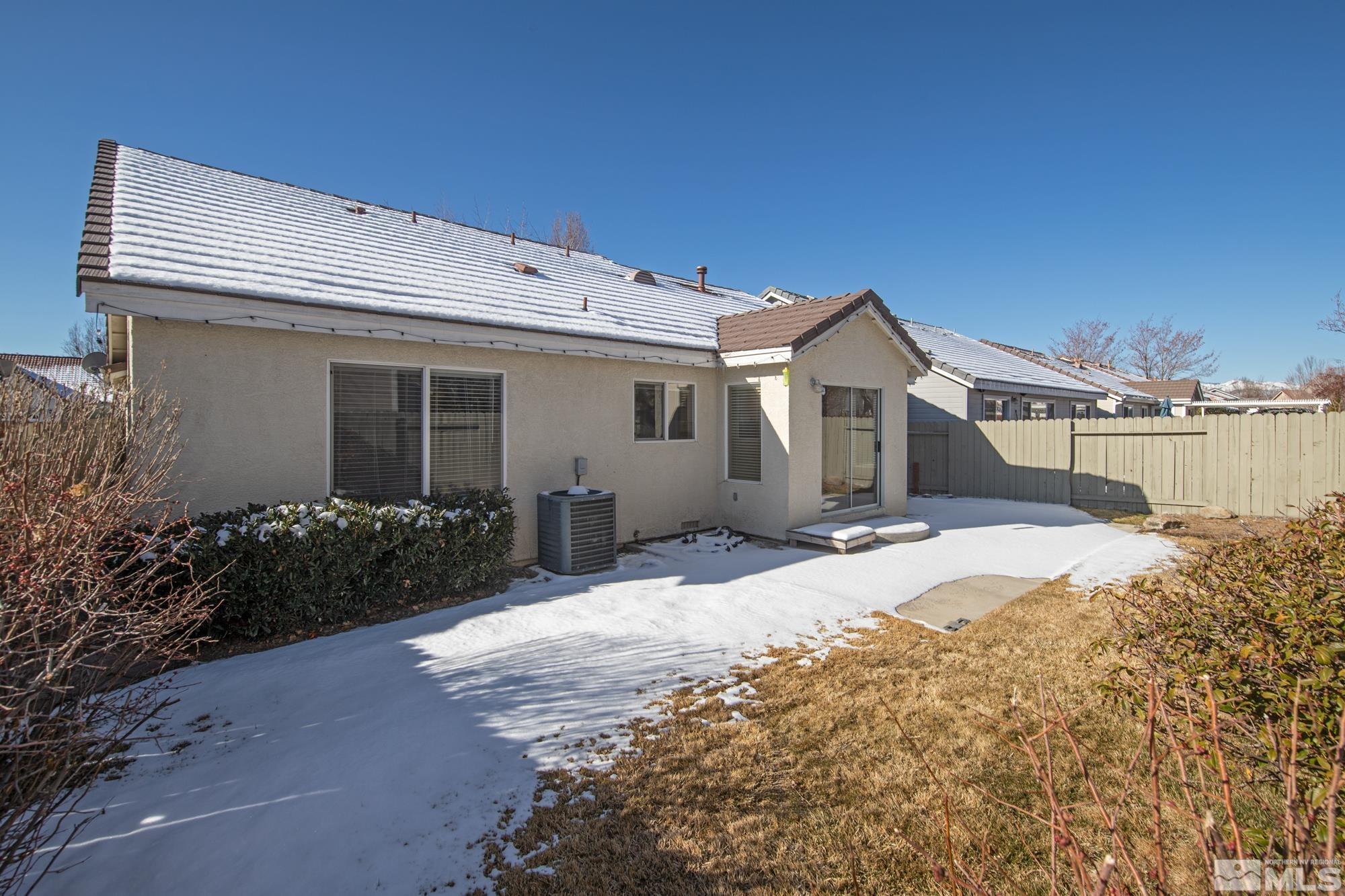 1685 Westmont Lane Reno, NV 89521 - Photo 15 of 28 a front view of a house with a yard