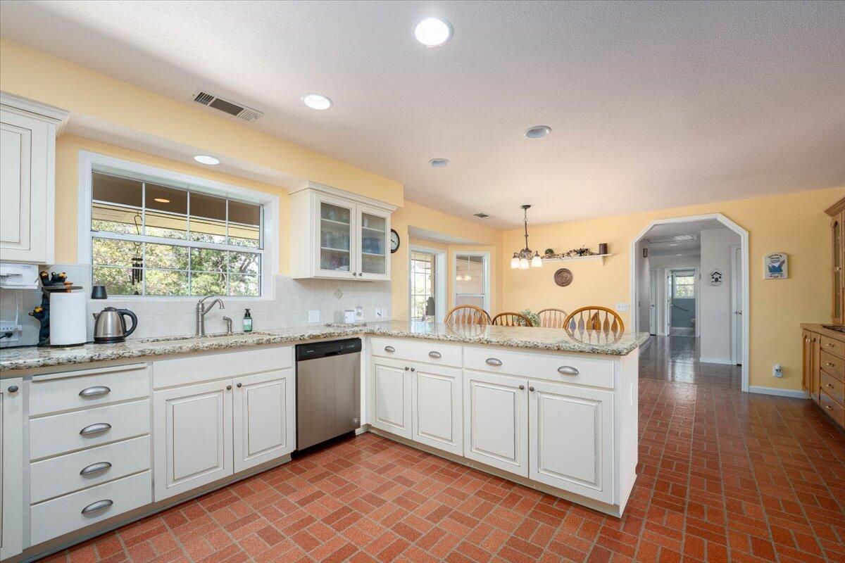 19035 Bonita Road Red Bluff, CA 96080 - Photo 11 of 55 a kitchen with a sink stove and cabinets