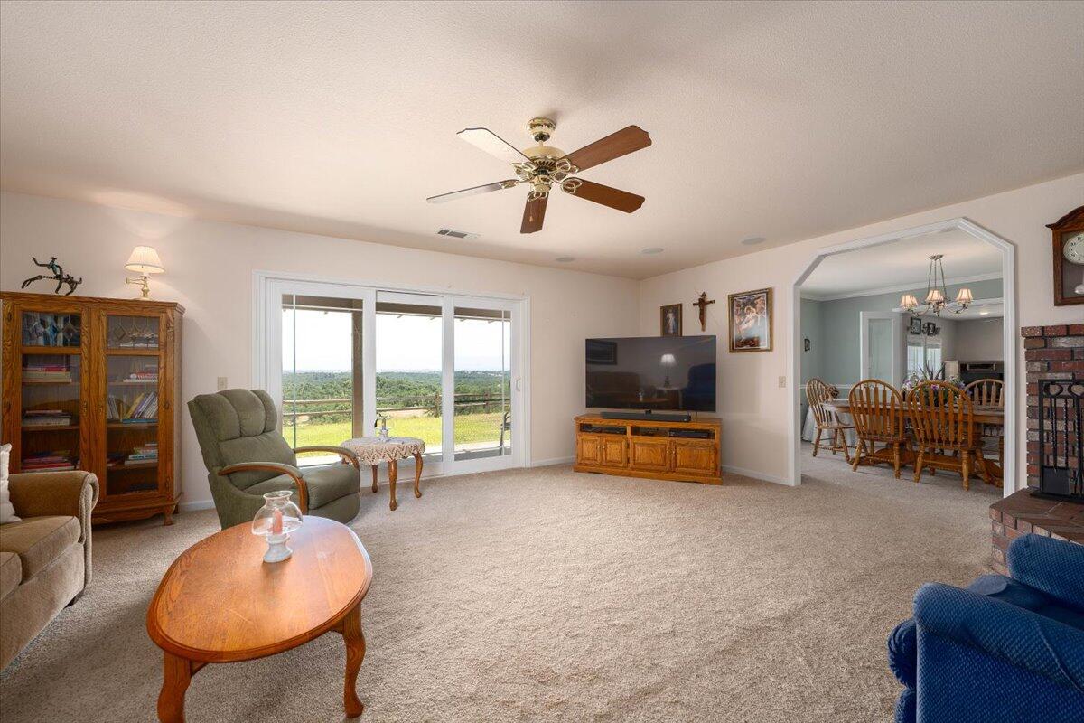 19035 Bonita Road Red Bluff, CA 96080 - Photo 14 of 55 a living room with furniture and a flat screen tv